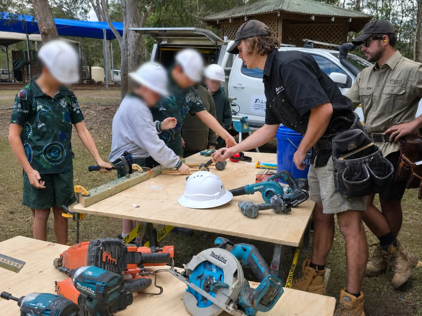 Akers Construction carpenters running a hands-on carpentry workshop with school students