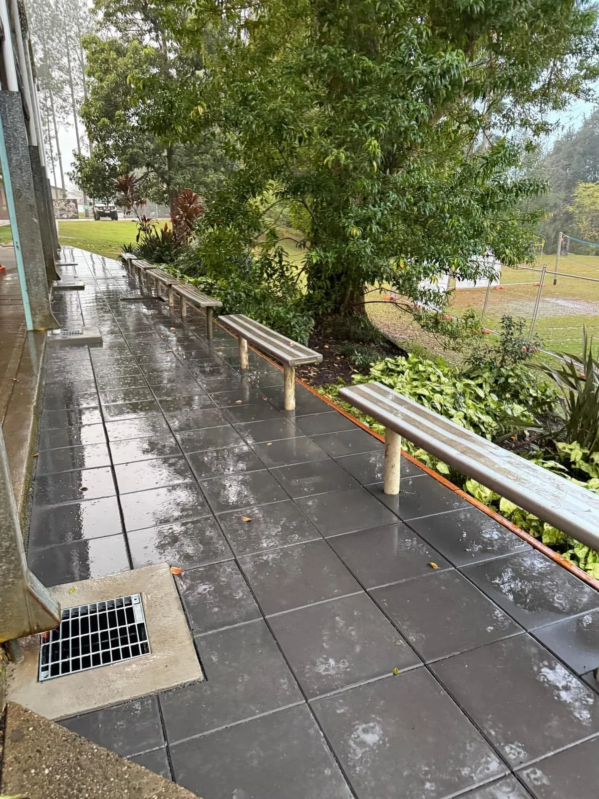 New paving and surface drainage grate along the Bellingen High School walkway