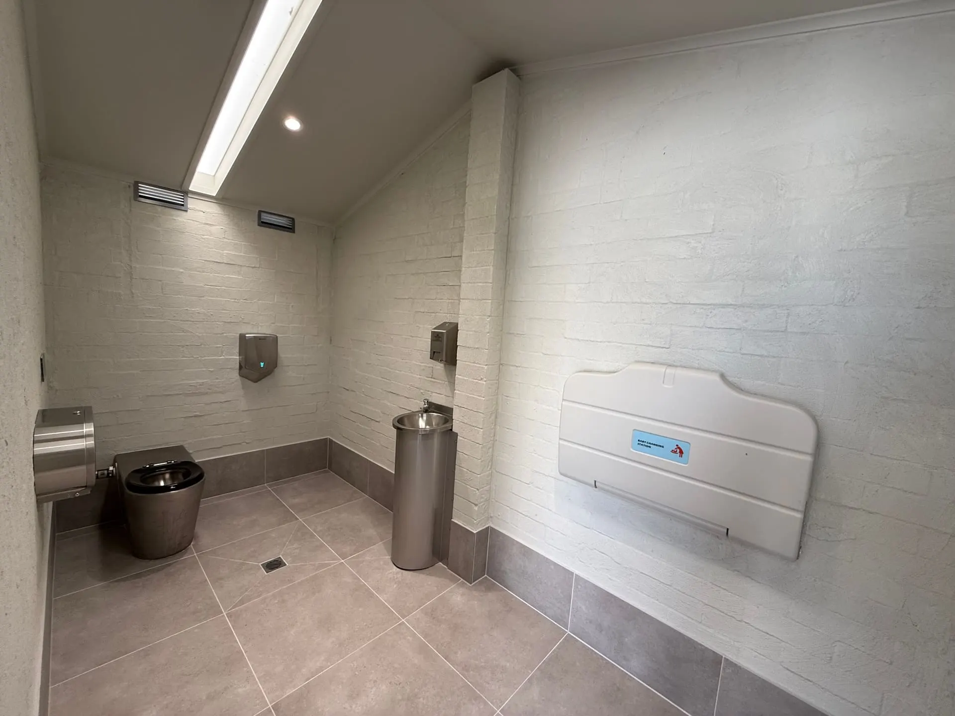 Public amenities interior with baby change table and tiled floor, Macksville