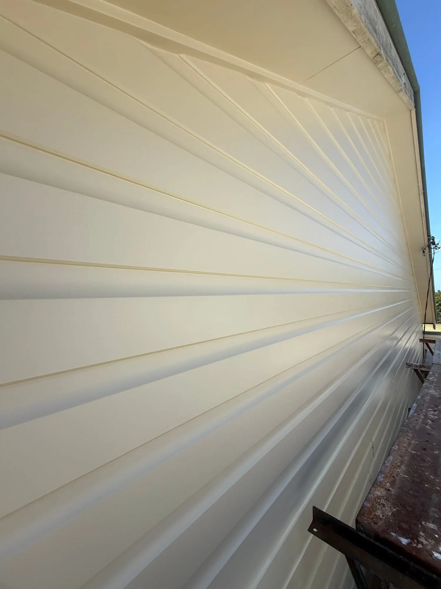 Close detail of new profiled metal wall cladding on a commercial building