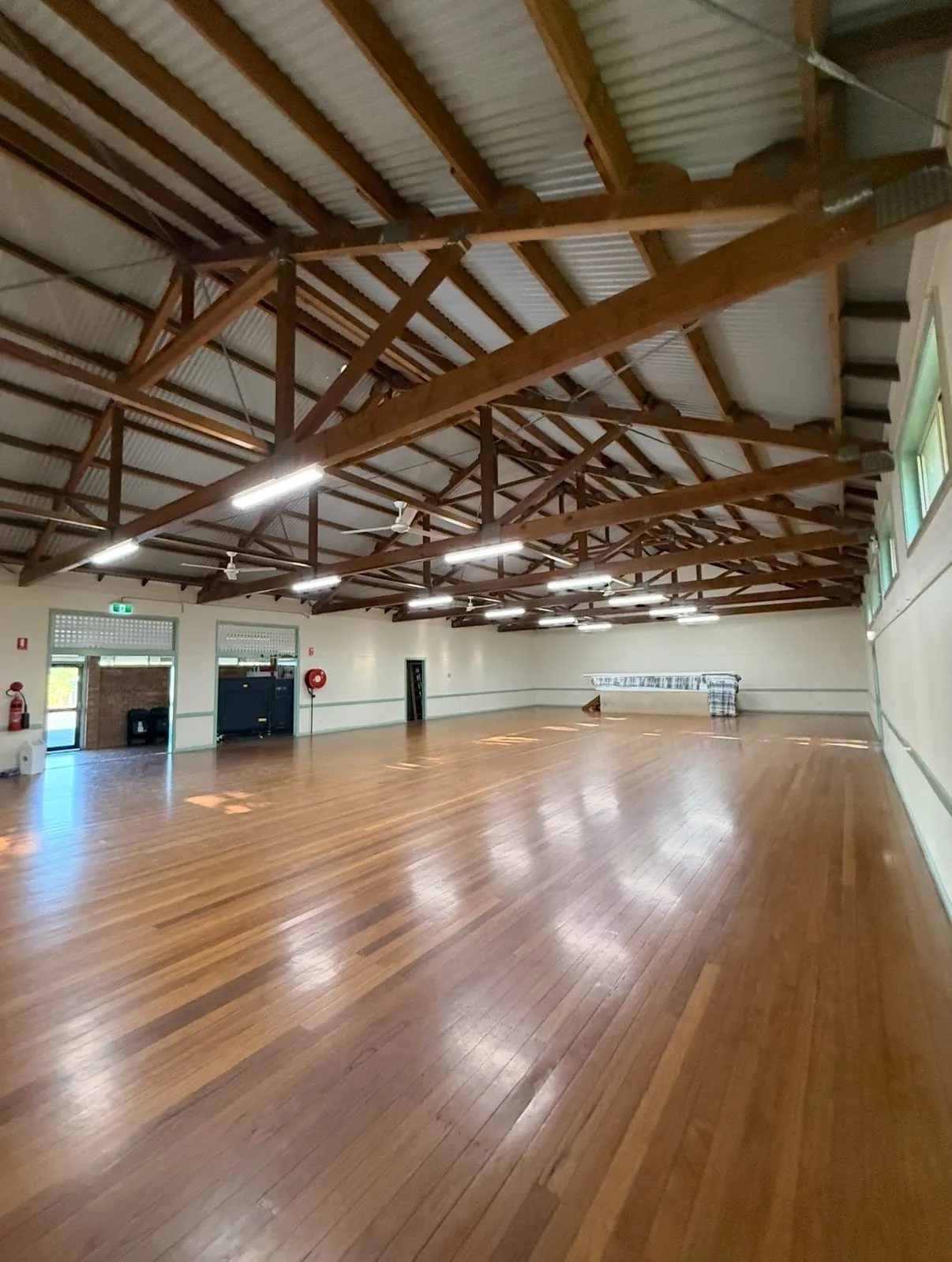 Community hall in Bellingen with restored hardwood floor and exposed timber trusses