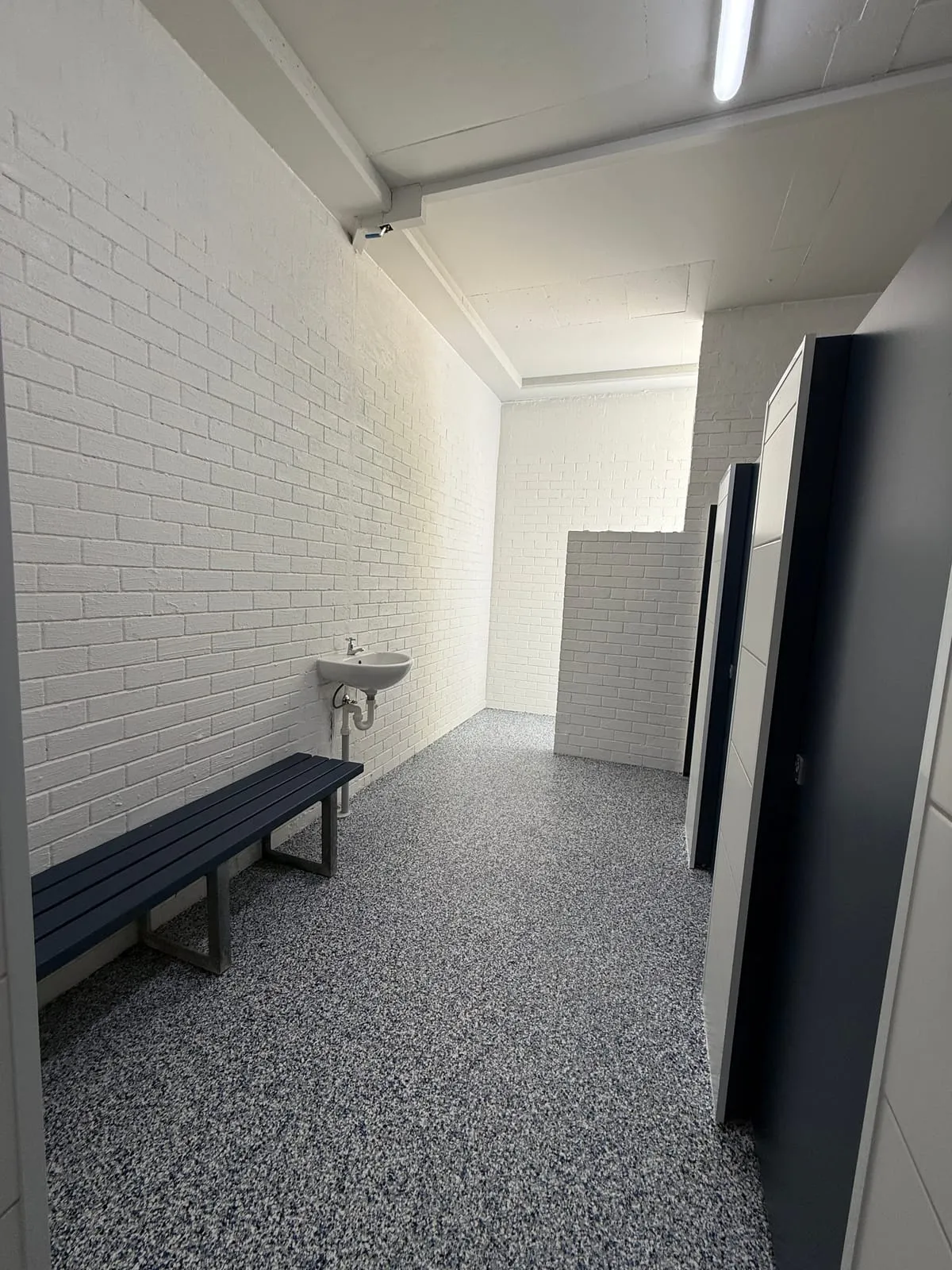 Refurbished changeroom with bench seating and slip-resistant flooring, Nambucca Heads Main Beach