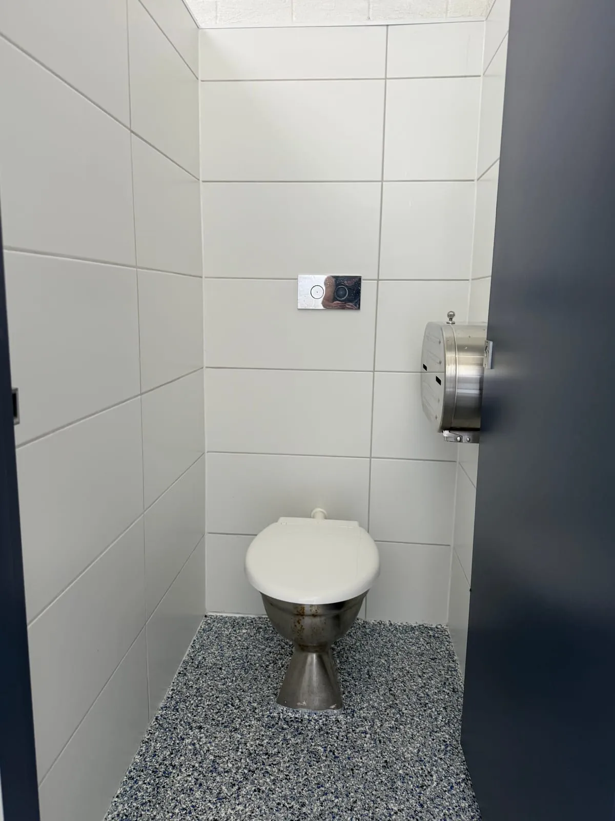 Newly tiled toilet cubicle with stainless dispenser at the Nambucca Heads Main Beach amenities