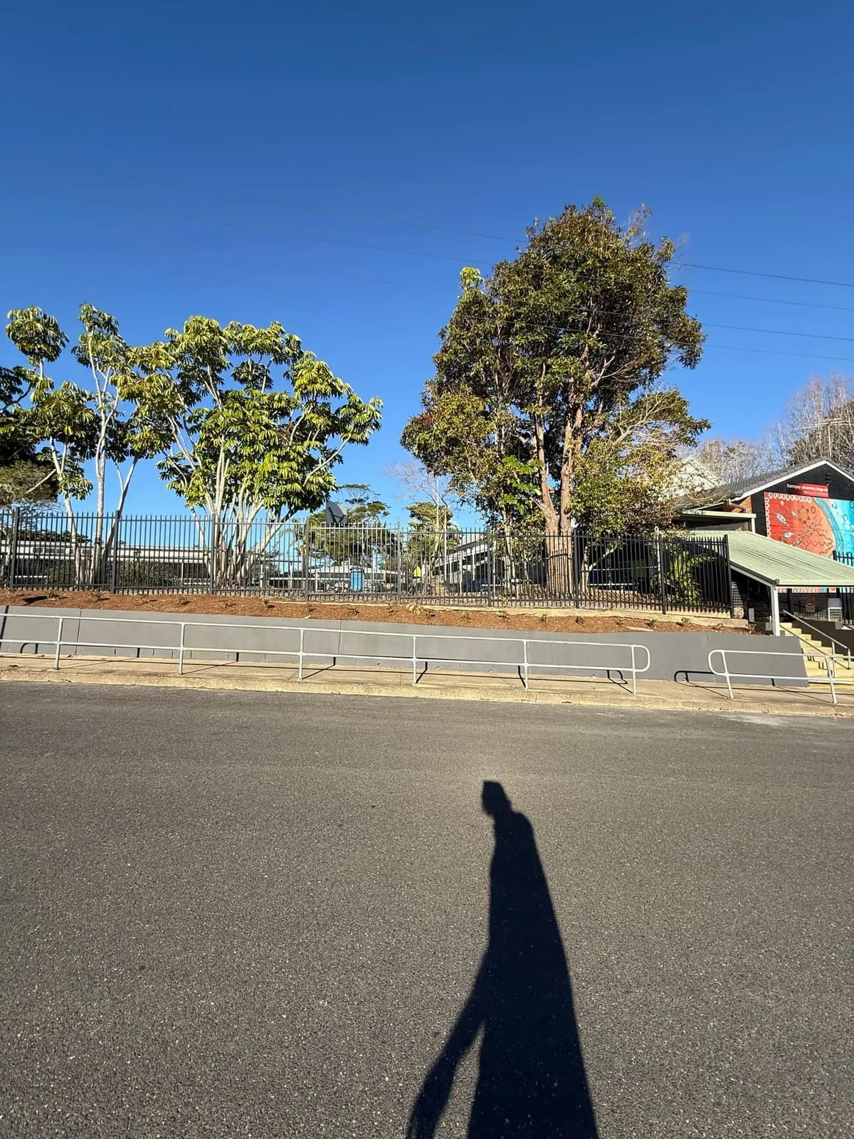 School frontage from across the road showing the new retaining wall and handrail, Nambucca Heads