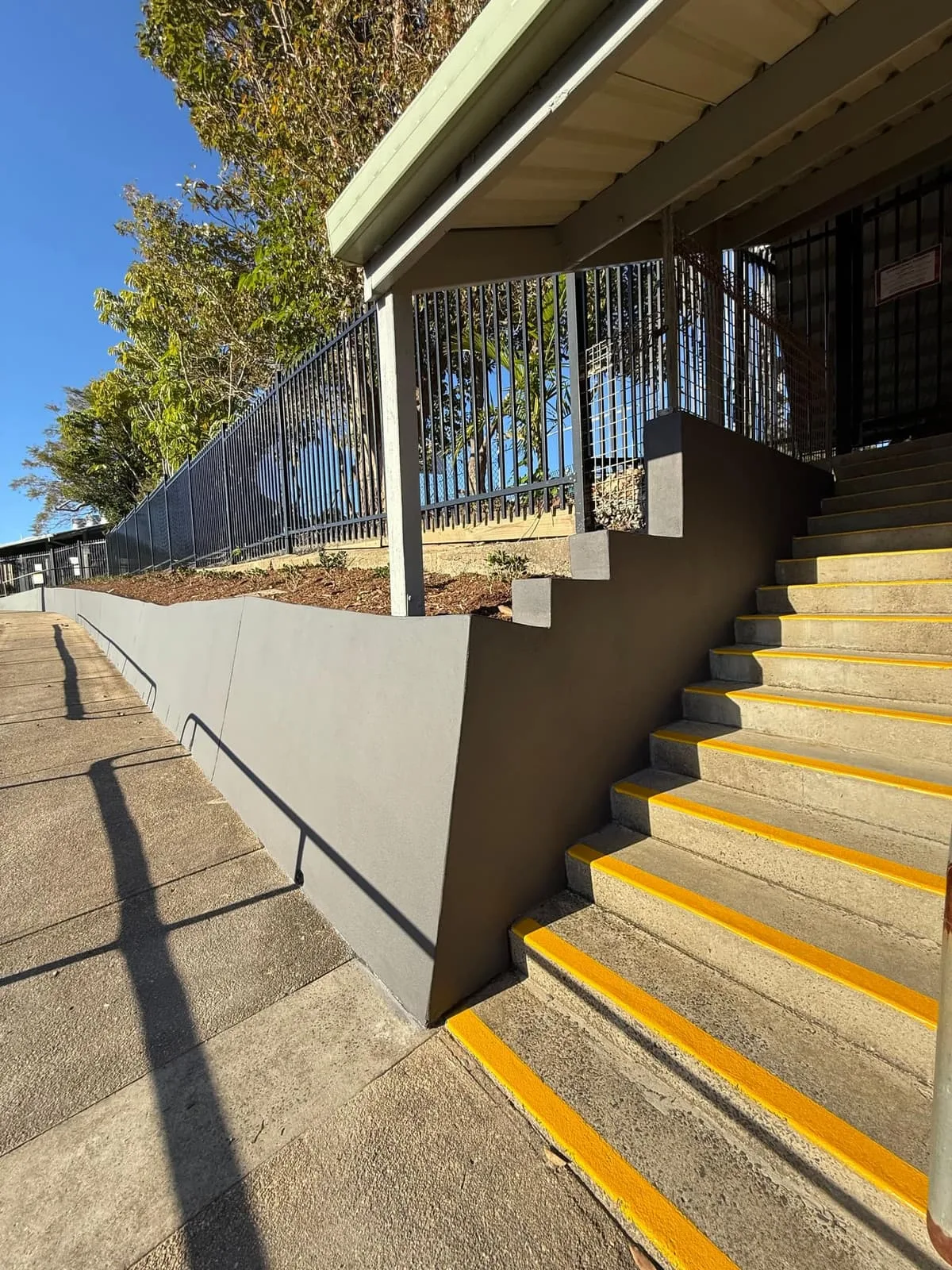 New concrete stairs with yellow safety nosings at the school entrance, Nambucca Heads