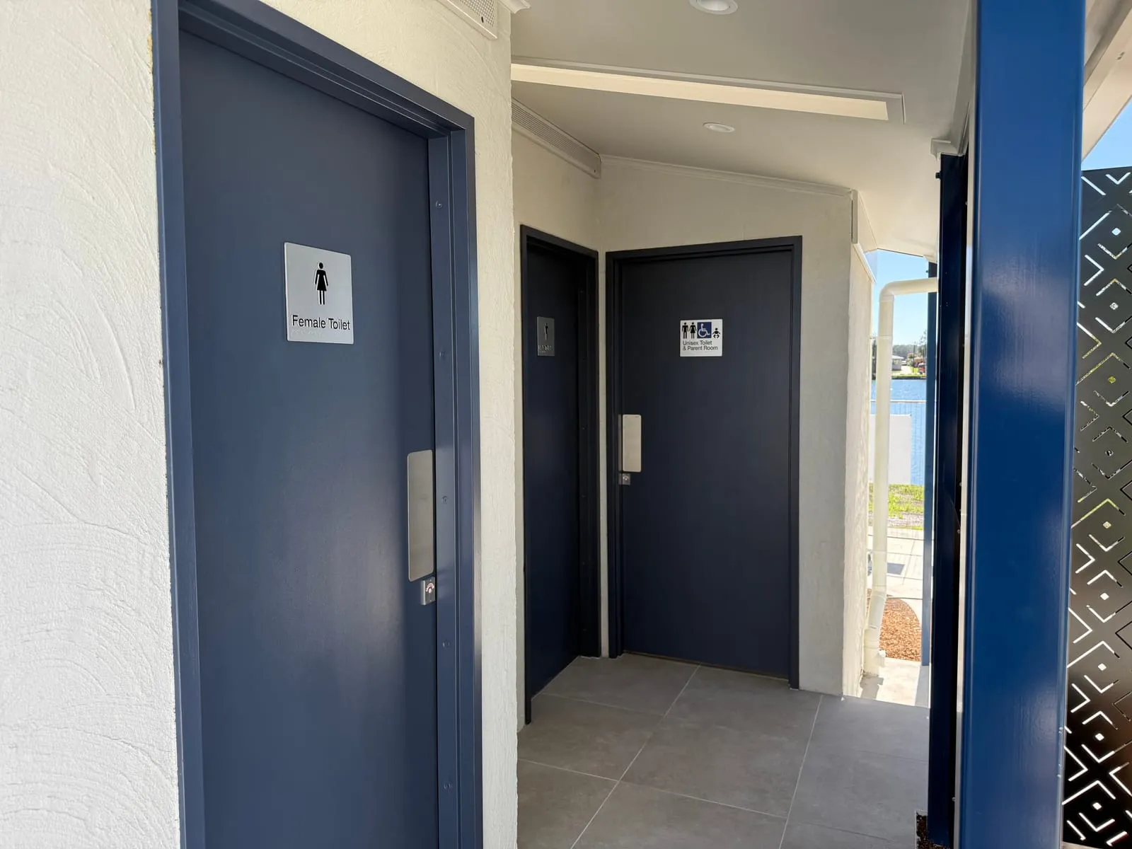 Navy entry doors to the new unisex and accessible toilets at the River Street amenities, Macksville