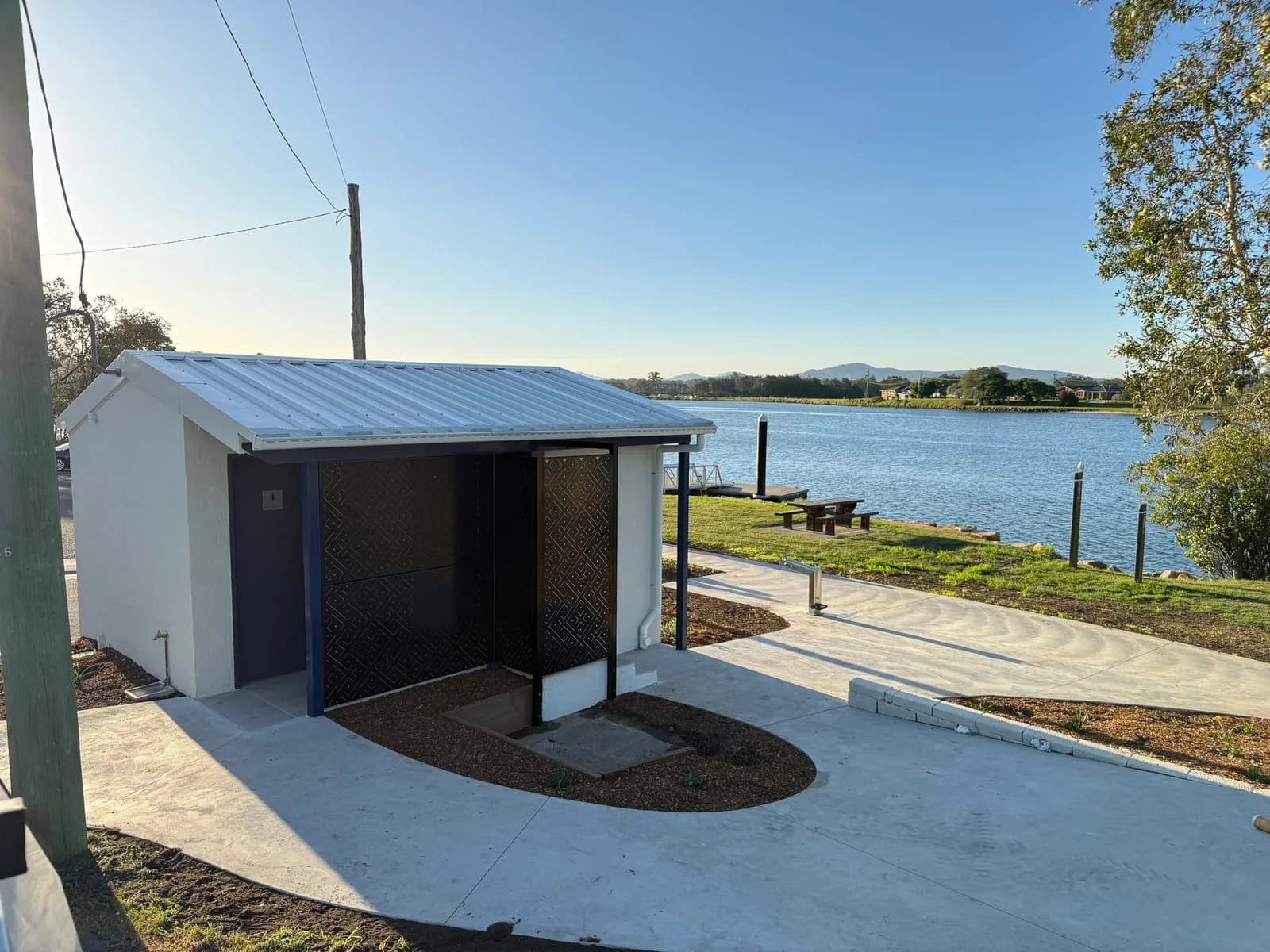 River Street public amenities block at sunrise with new concrete apron and riverfront picnic area, Macksville